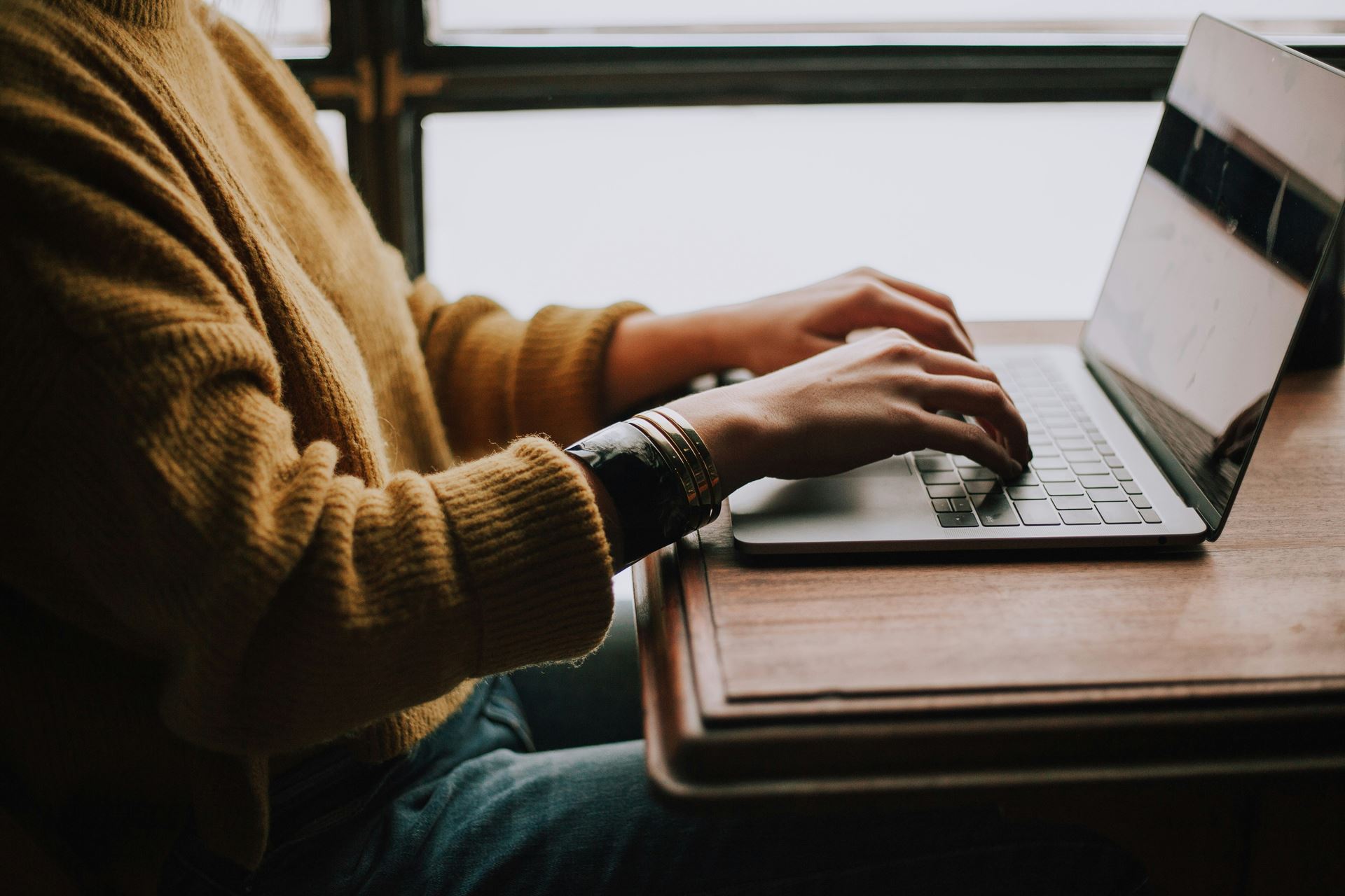 Person typing on keyboard